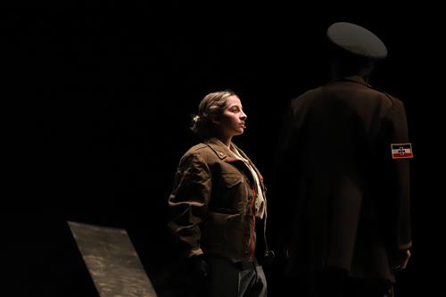 Isabella Mora on stage performing in GISH's production of, "All Quiet on the Western Front".